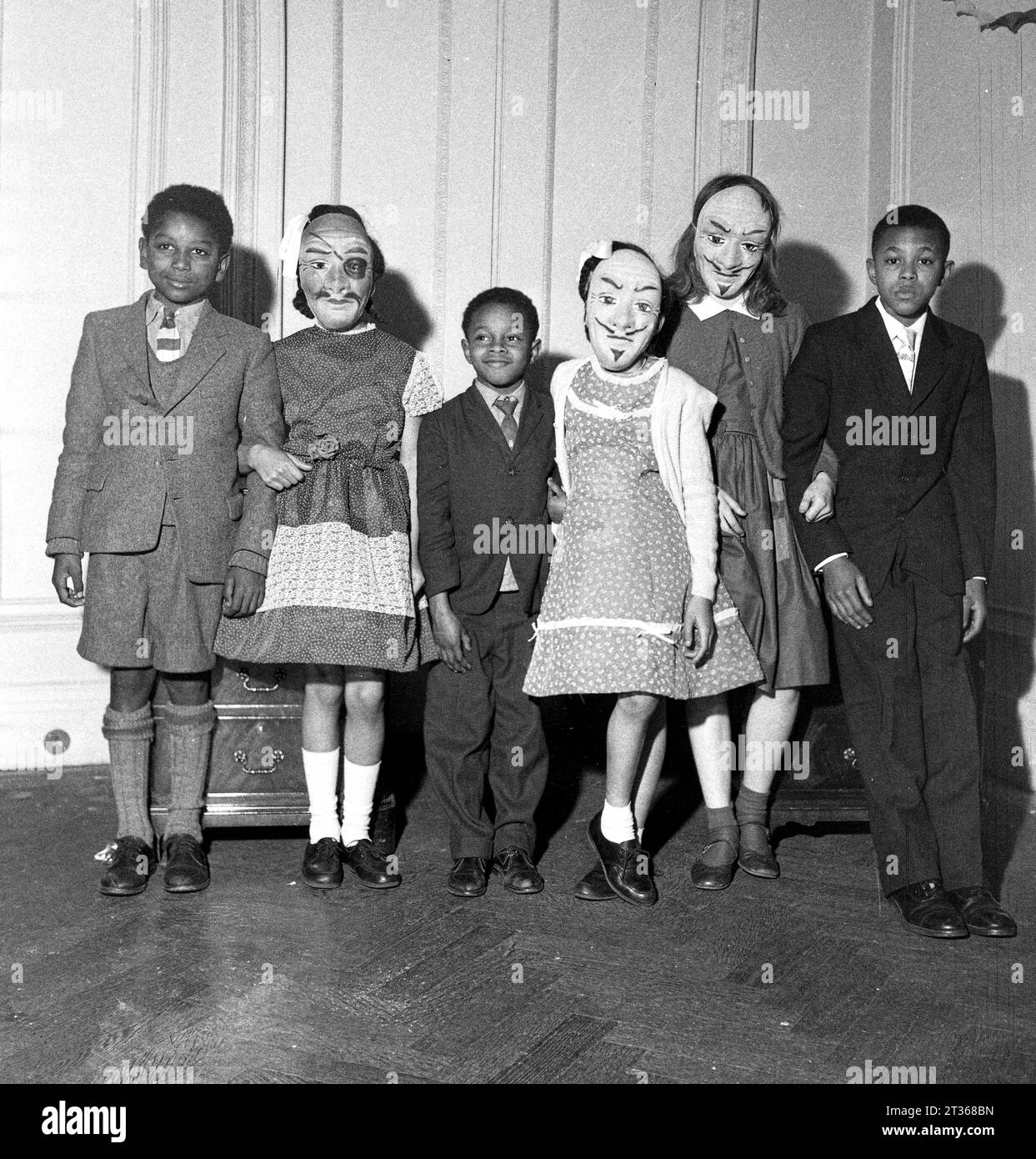 Windrush children enjoy a party with the locals in London in the 1950s Stock Photo