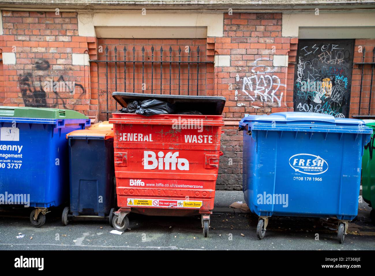 A Biffa commercial waste bin in a side street in Manchester, UK. Biffa