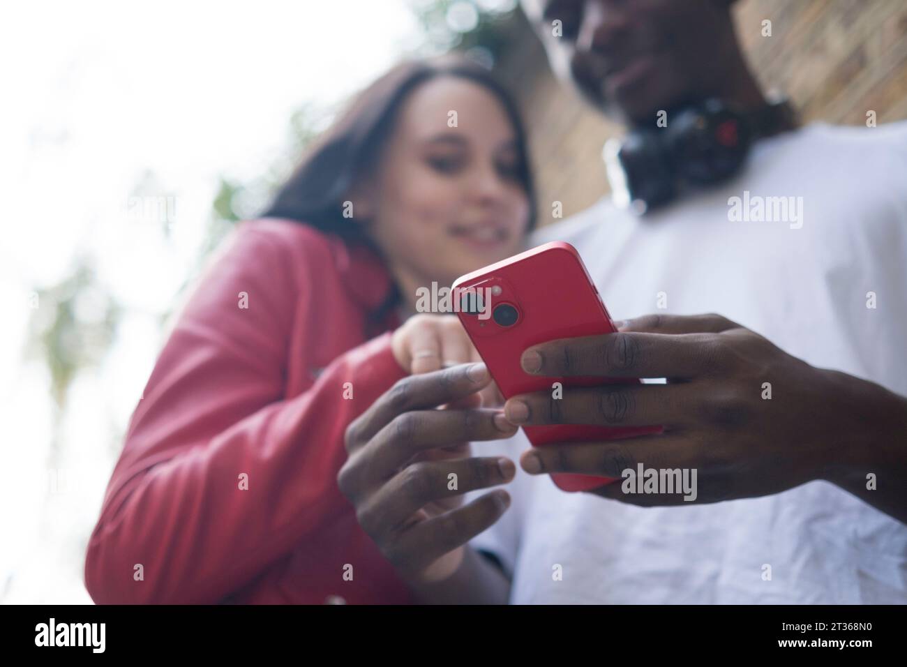 Young couple using smart phone Stock Photo