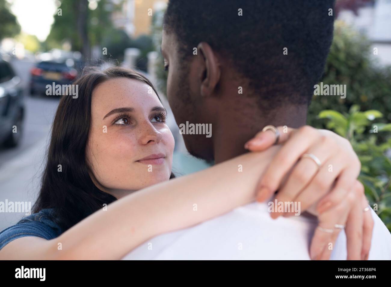Man arm around woman group hi-res stock photography and images - Alamy