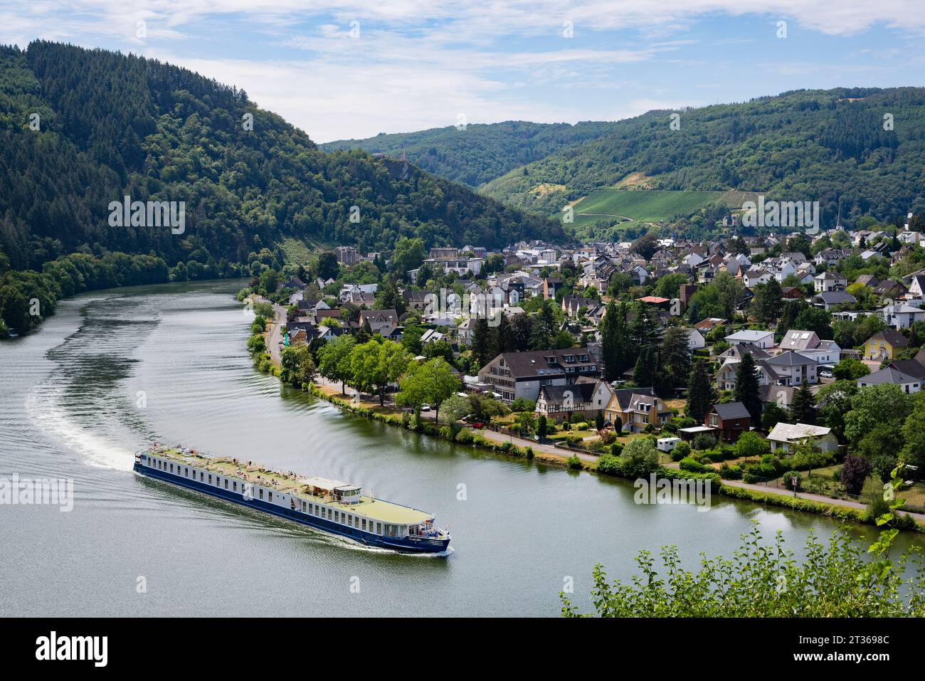 Germany, Rhineland-Palatinate, Traben-Trarbach, Ferry leaving riverside town in Mosel Valley Stock Photo