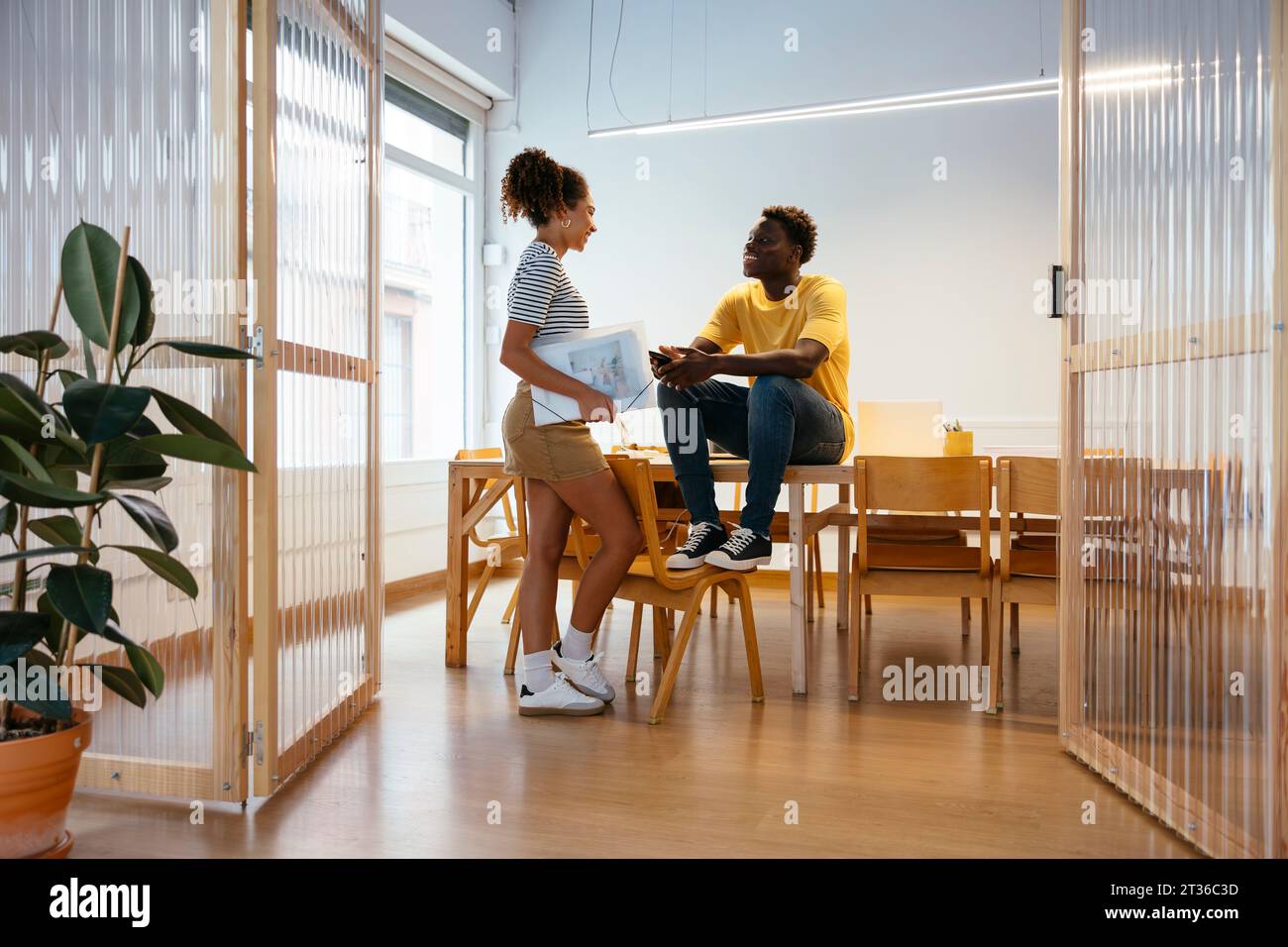 Friends talking together at university Stock Photo