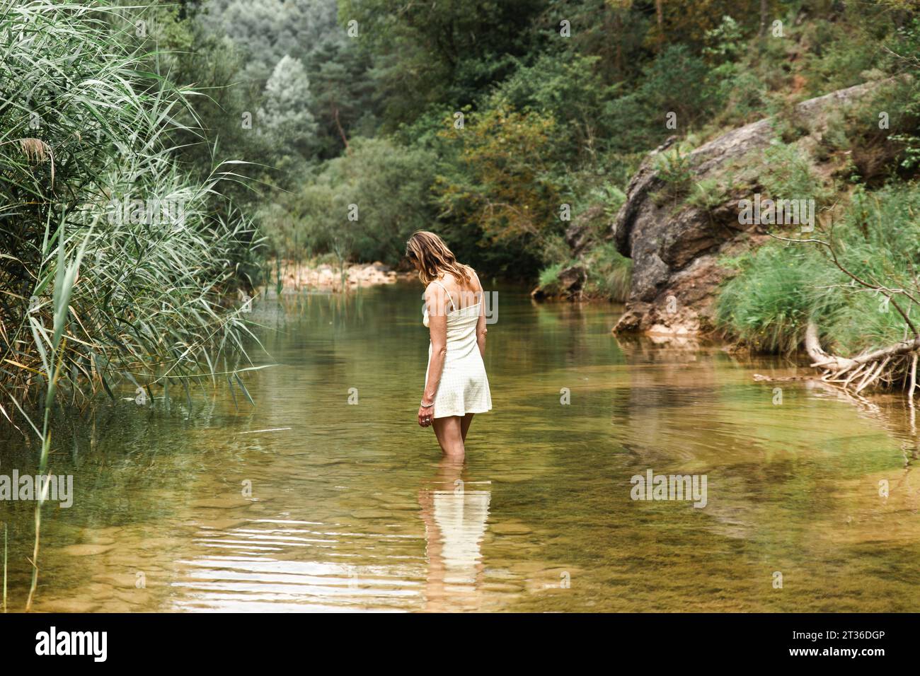 Woman standing at river hi-res stock photography and images - Alamy