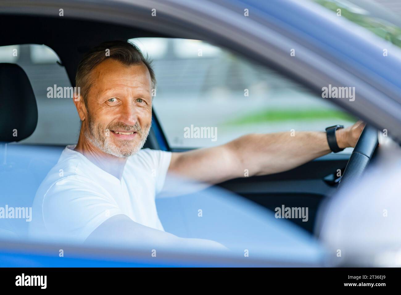 Man sitting at wheel of car hi-res stock photography and images - Alamy
