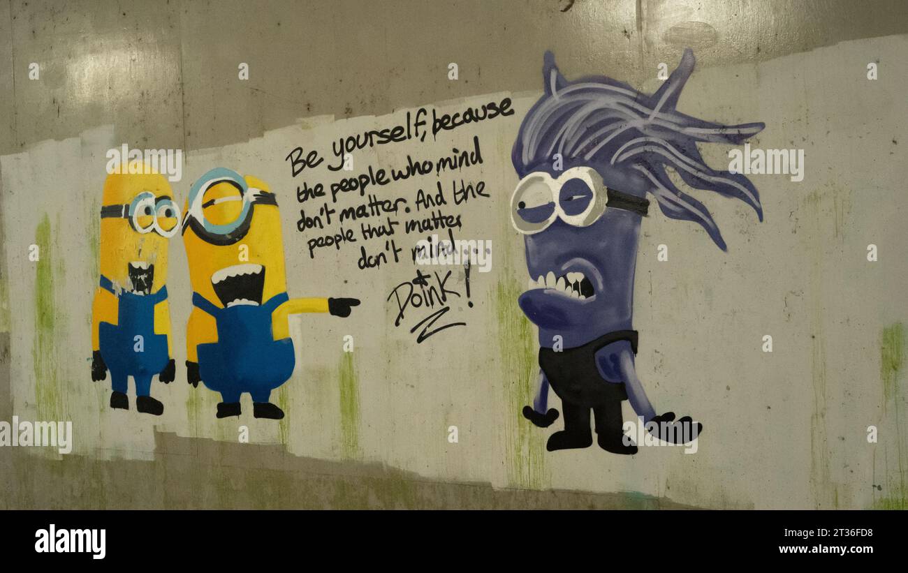 Minion characters painting with saying under Rawreth Bridge Stock Photo
