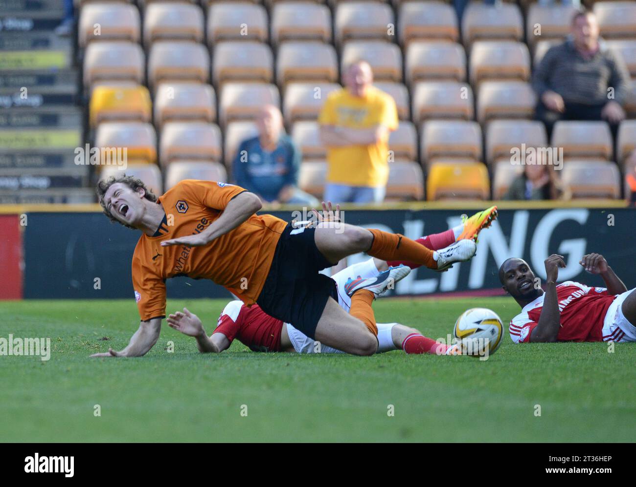 Kevin McDonald of Wolverhampton Wanderers is fouled from behind. Sky Bet Football League One -  Wolverhampton Wanderers v Swindon Town 14/09/2013 Stock Photo