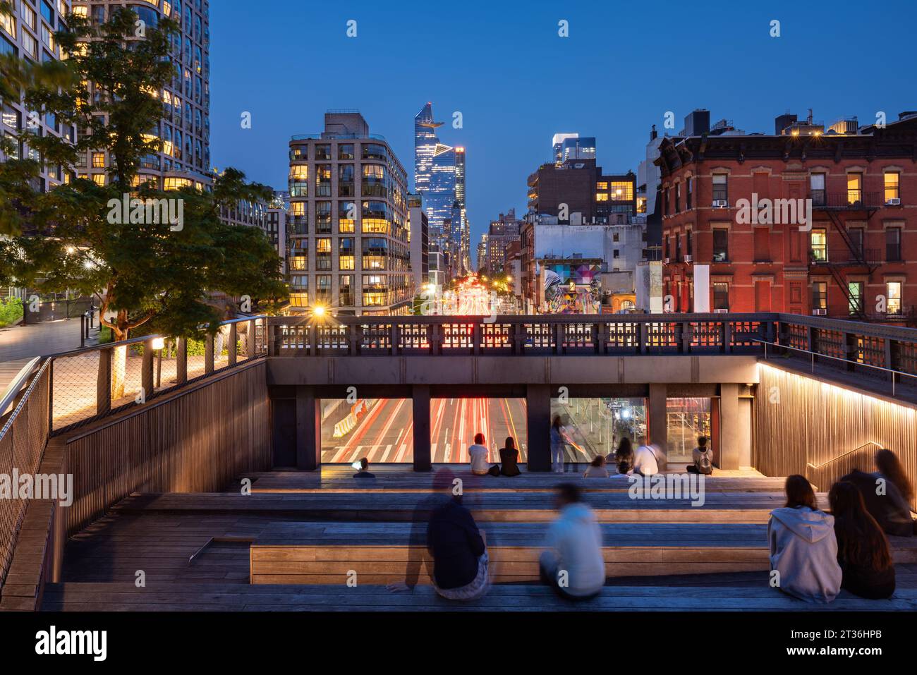 A summer evening at the Highline lookout (High Line Park) on 10th Avenue with view of the Hudson Yards skyscrapers. Chelsea, Manhattan, New York City Stock Photo