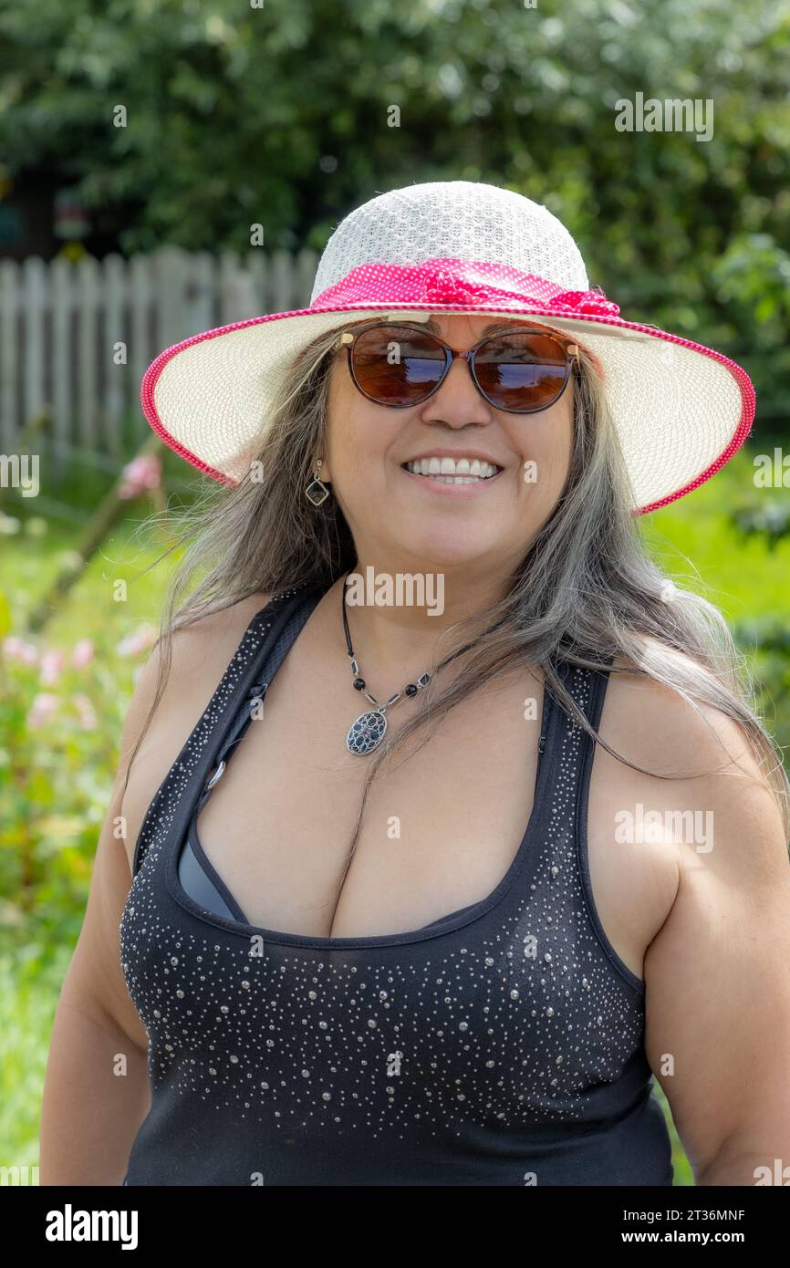 chubby mature Portrait of chubby mature Mexican woman with happy smiling expression on  face, looking at camera, casual clothes, strappy blouse, hat and sunglasses  Stock Photo - Alamy