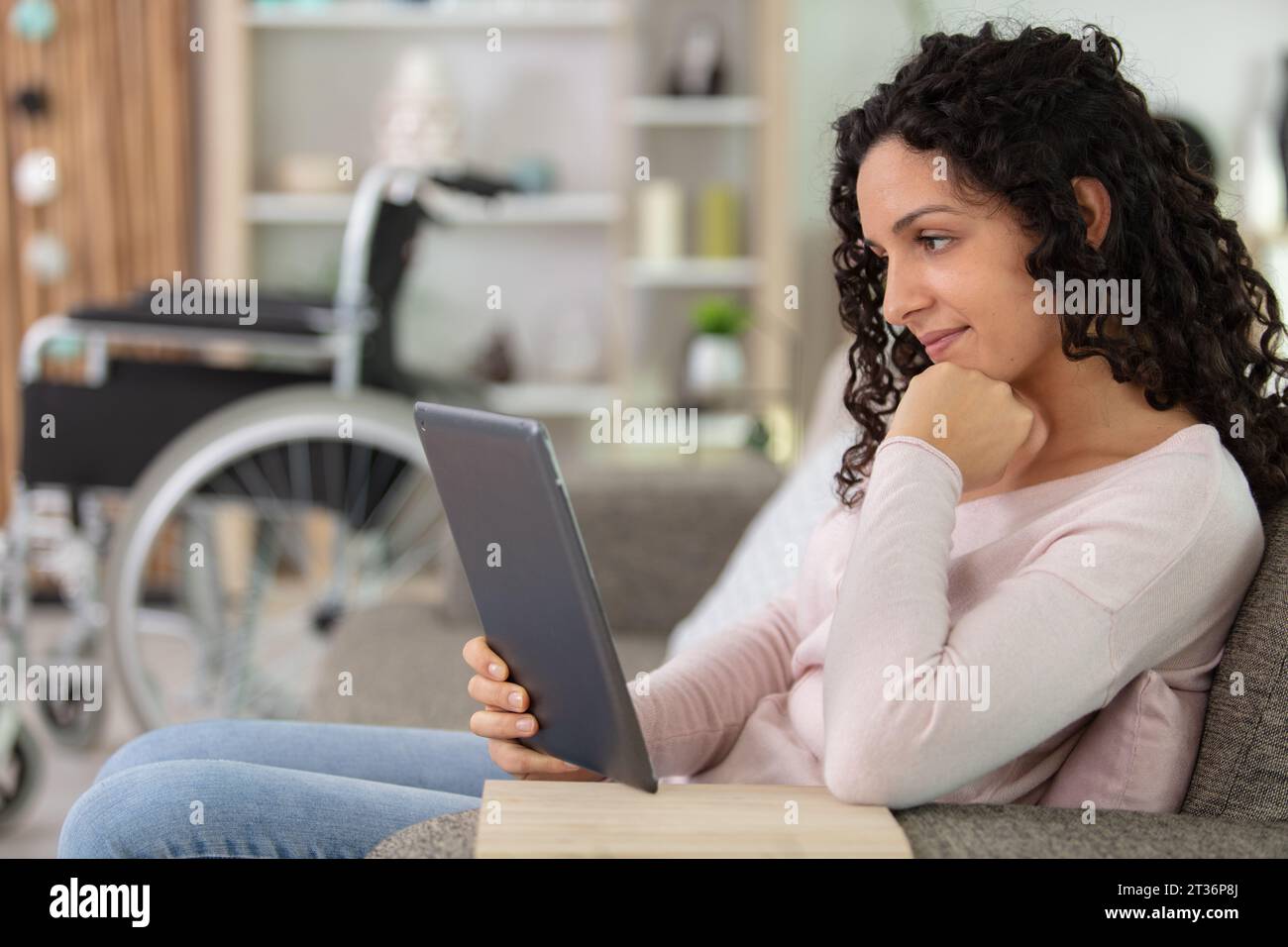 disabled young businesswoman using digital tablet Stock Photo