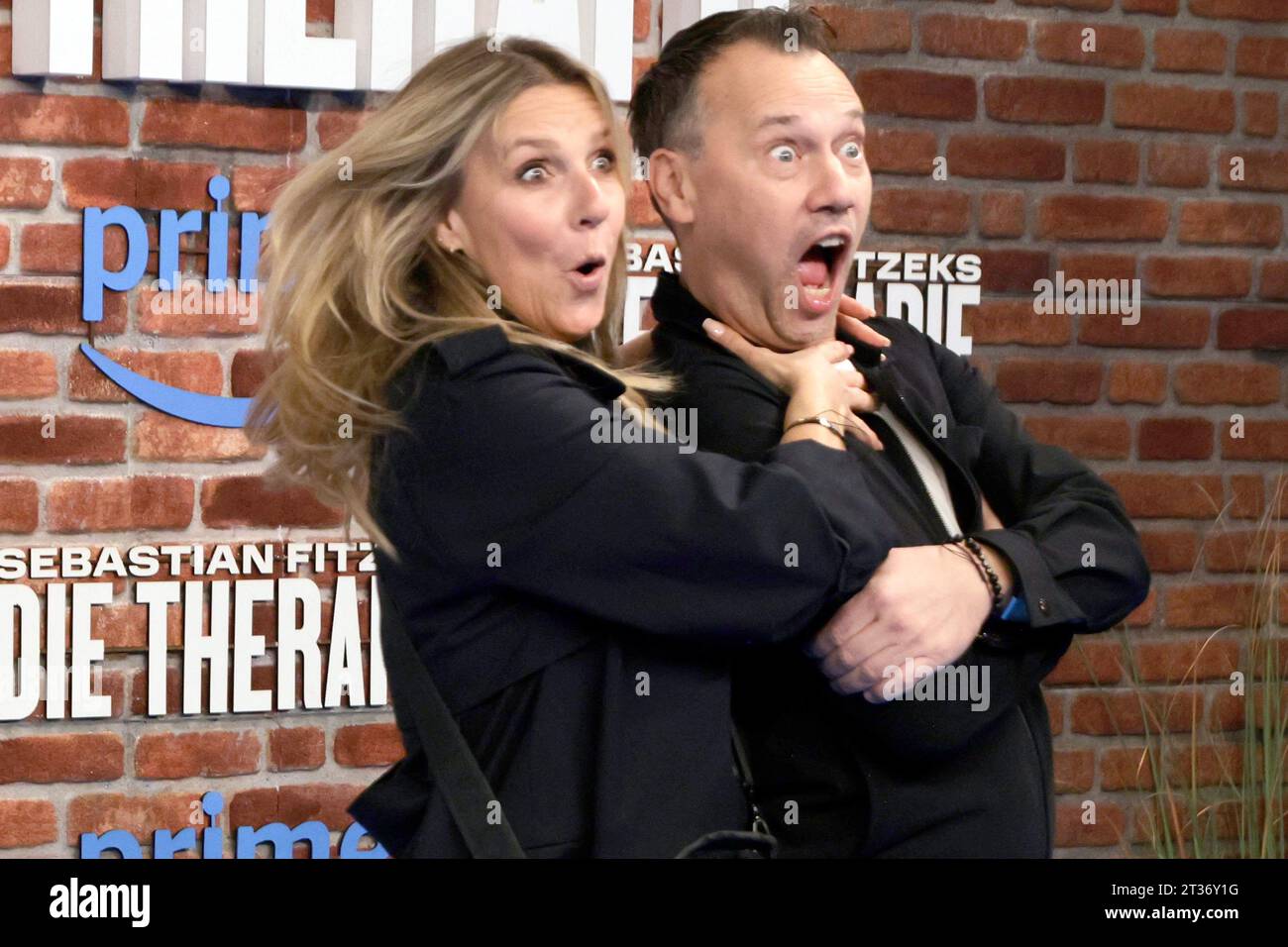 Berlin, Germany. 23rd Oct, 2023. Kim Fisher, host, and Sebastian Fitzek,  thriller author, joke at the premiere of the series 