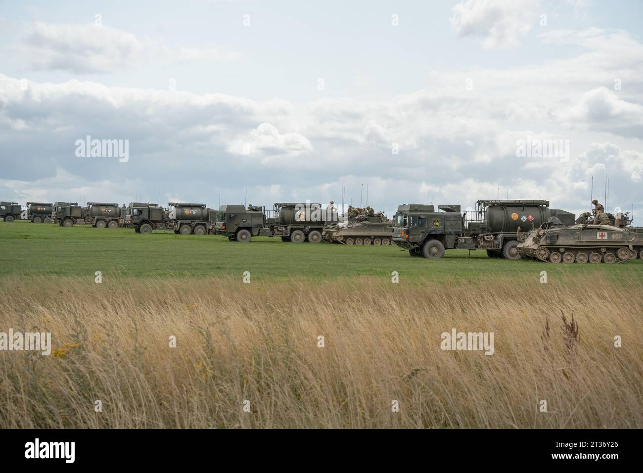 Several British army unit support tankers refuelling Warrior FV510 on a military exercise Stock Photo