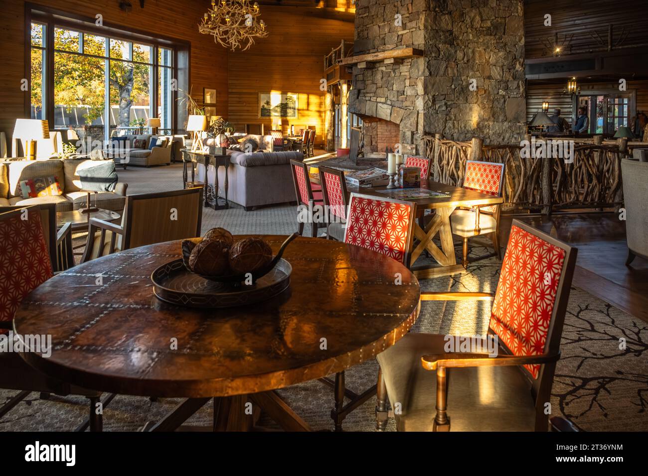 Couple relaxing at sunset with a fire in the stone fireplace at the Brasstown Valley Resort & Spa in Young Harris, Georgia. (USA) Stock Photo