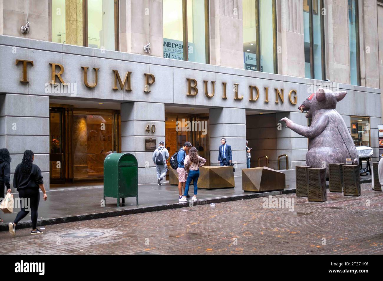 Giant inflatable rat in front of Trump Building Manhattan NYC people Stock Photo
