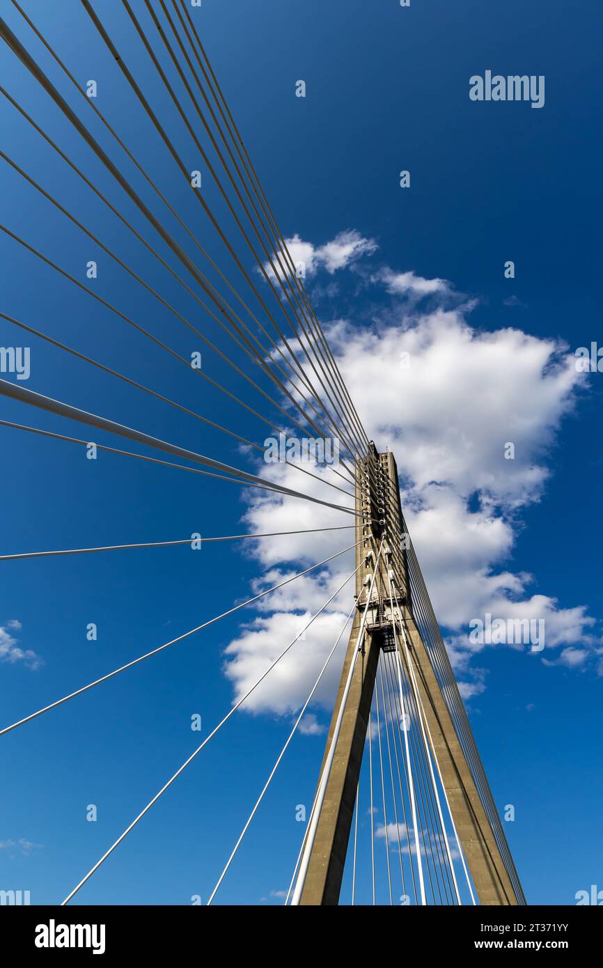 Fixing the ropes in the concrete pylon of the rope bridge. View of the ...