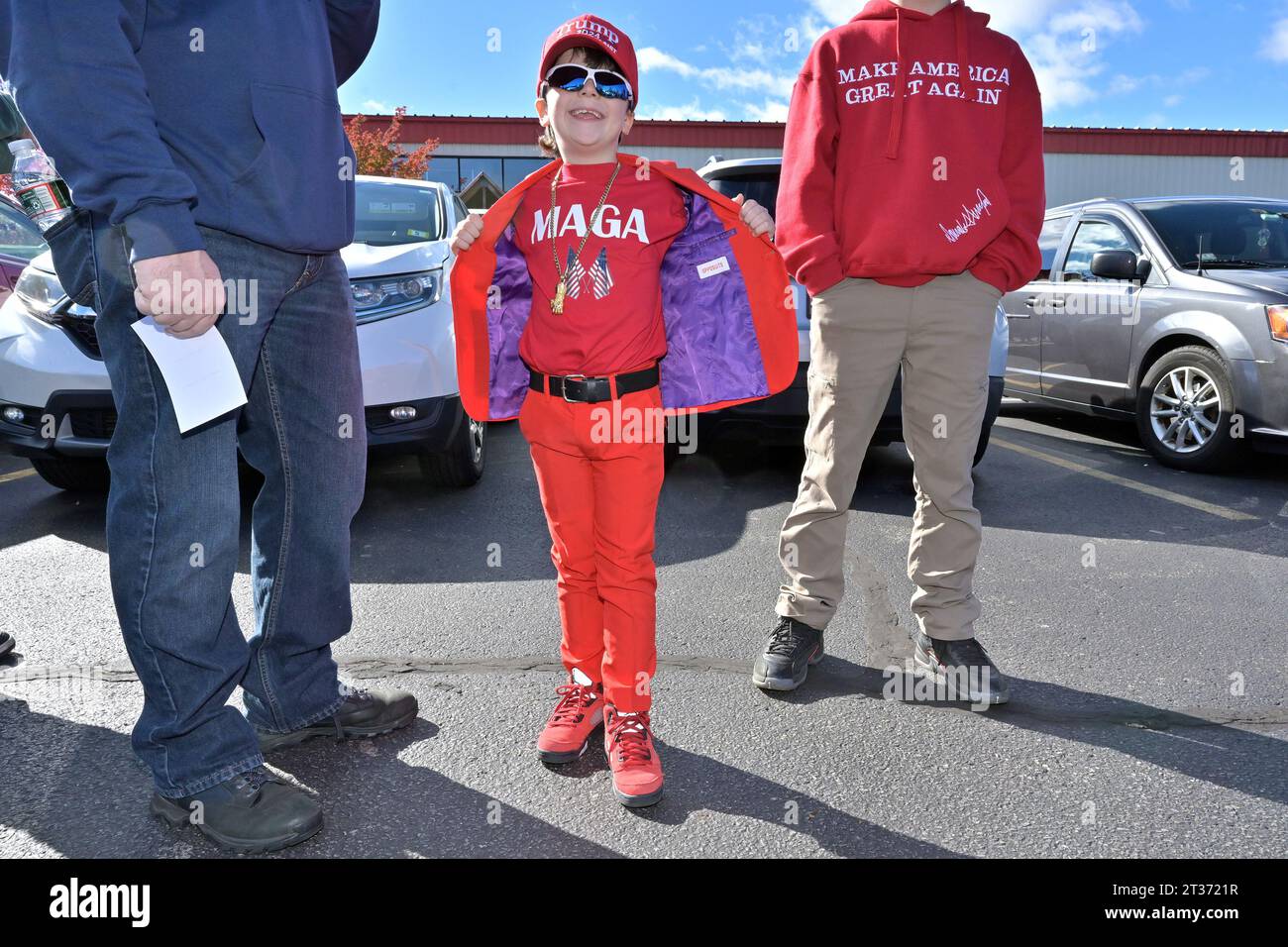 Derry, USA. 23rd Oct, 2023. Mason Morency, 7, of Derry, N.H. waits in line with his family