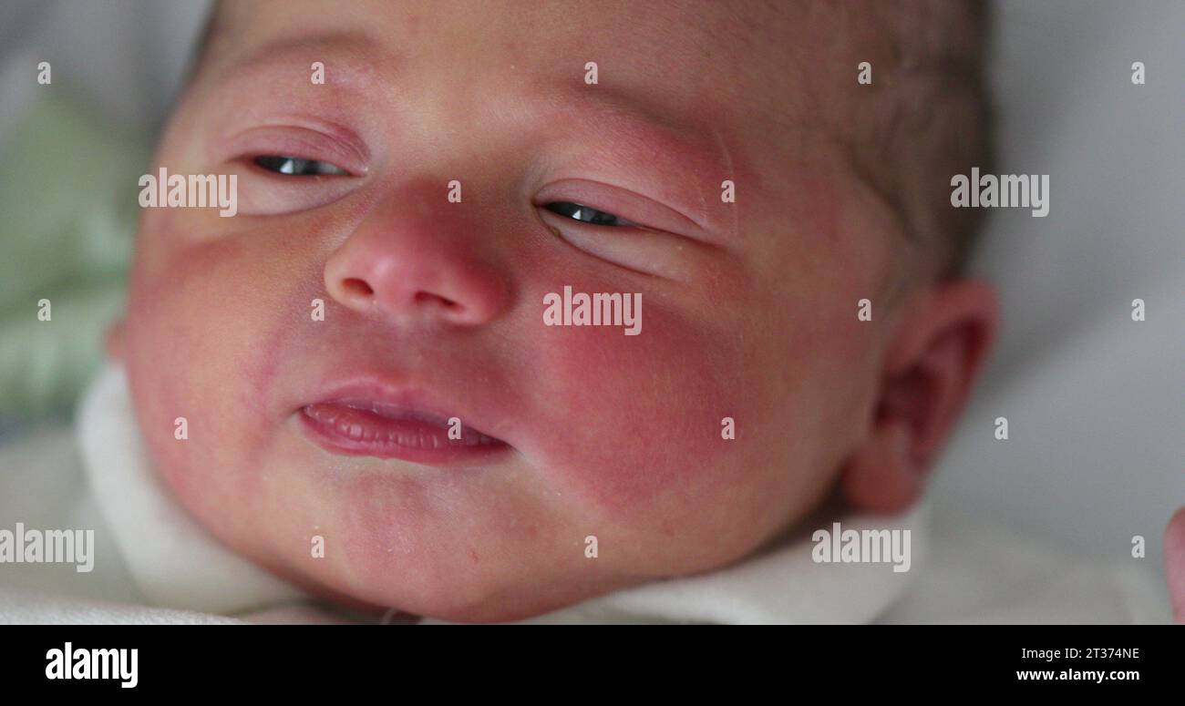 Newborn baby first day of life waking up opening eyes. Infant toddler wakes up Stock Photo Alamy