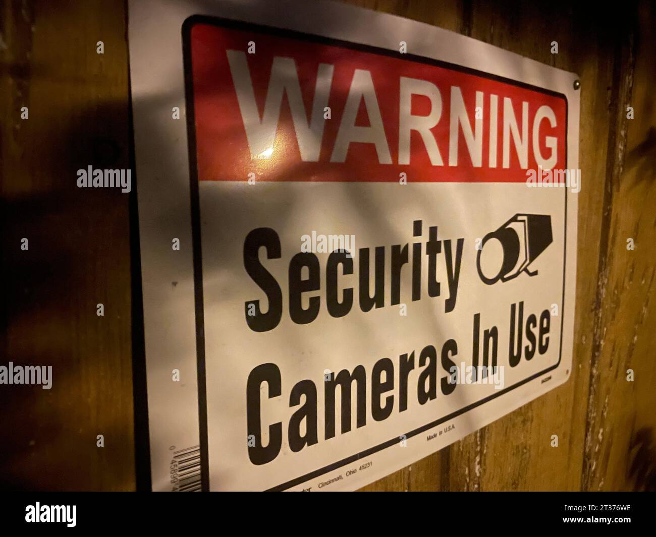 Warning security camera is use sign on a home background Stock Photo