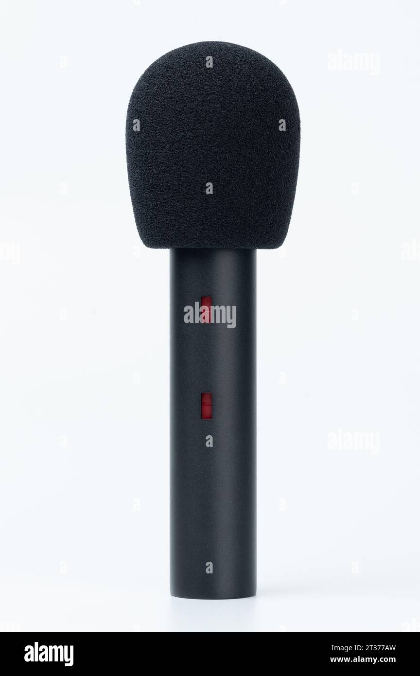 Black cardioid microphone with wind protector isolated on white studio background Stock Photo