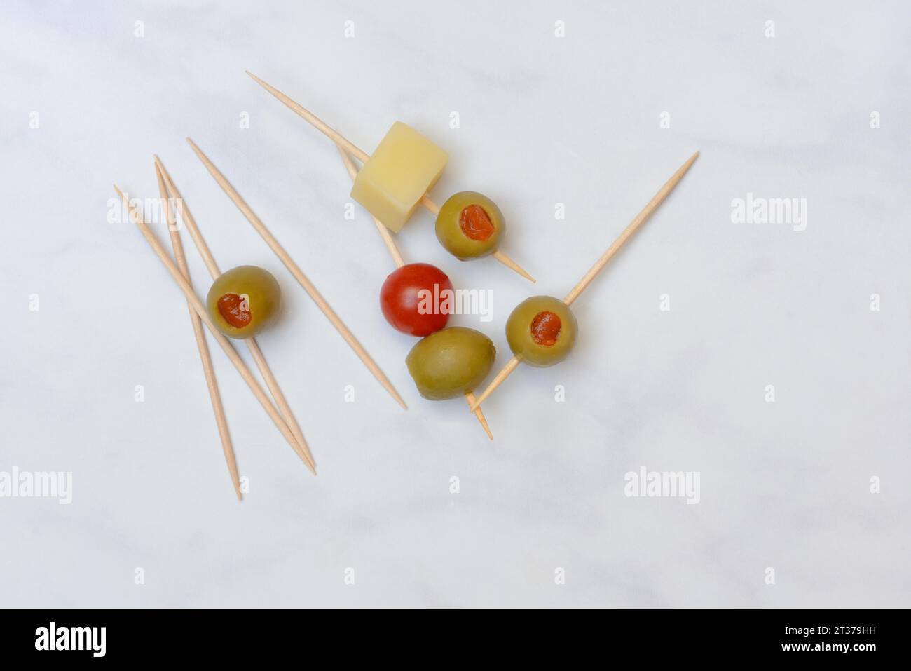 Stuffed olives on toothpicks, green olive Stock Photo Alamy