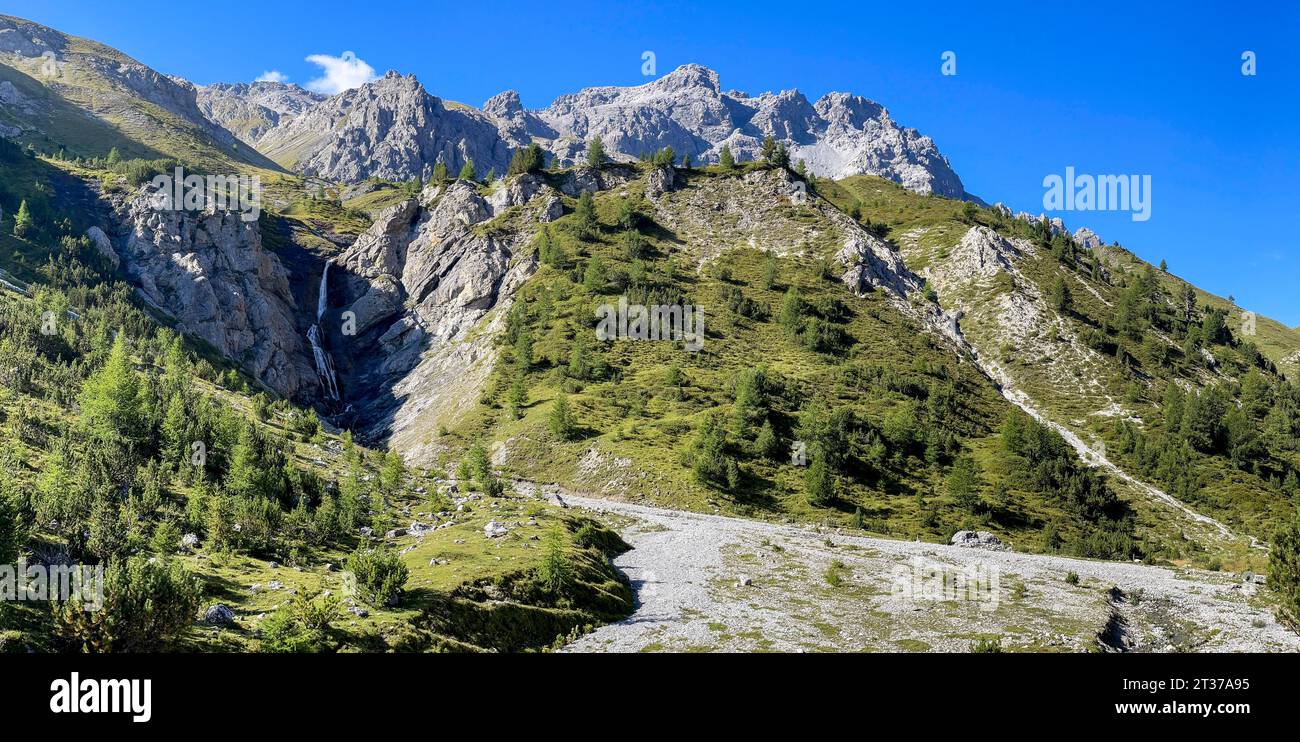 Waterfall and alluvial fan in the Alps, Val Vau, Tschierv in the Muenstertal, Engadin, Graubuenden, Switzerland Stock Photo