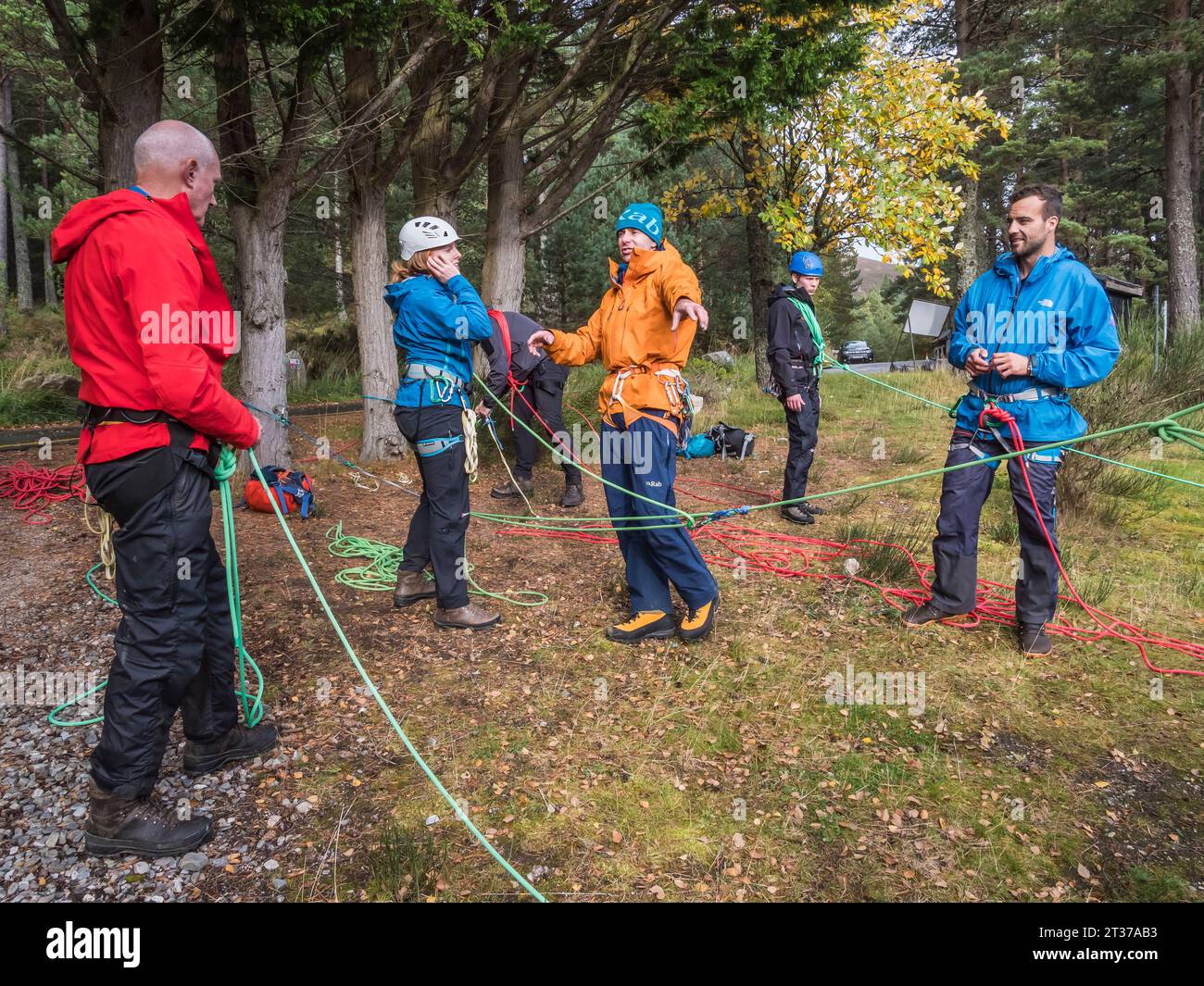 People learning mountaineering rope skills at Glenmore Lodge Outdoor Education Centre located in the Cairngorm National Park near Aviemore Stock Photo