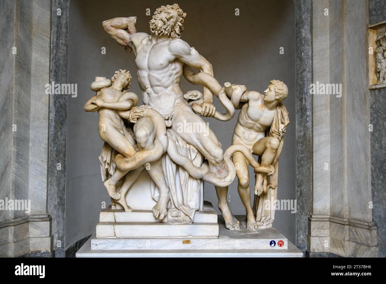 Photo with detail without base Frontal view of original antique marble sculpture Laocoon Group Priest Laocoon and his sons fighting with snakes Stock Photo