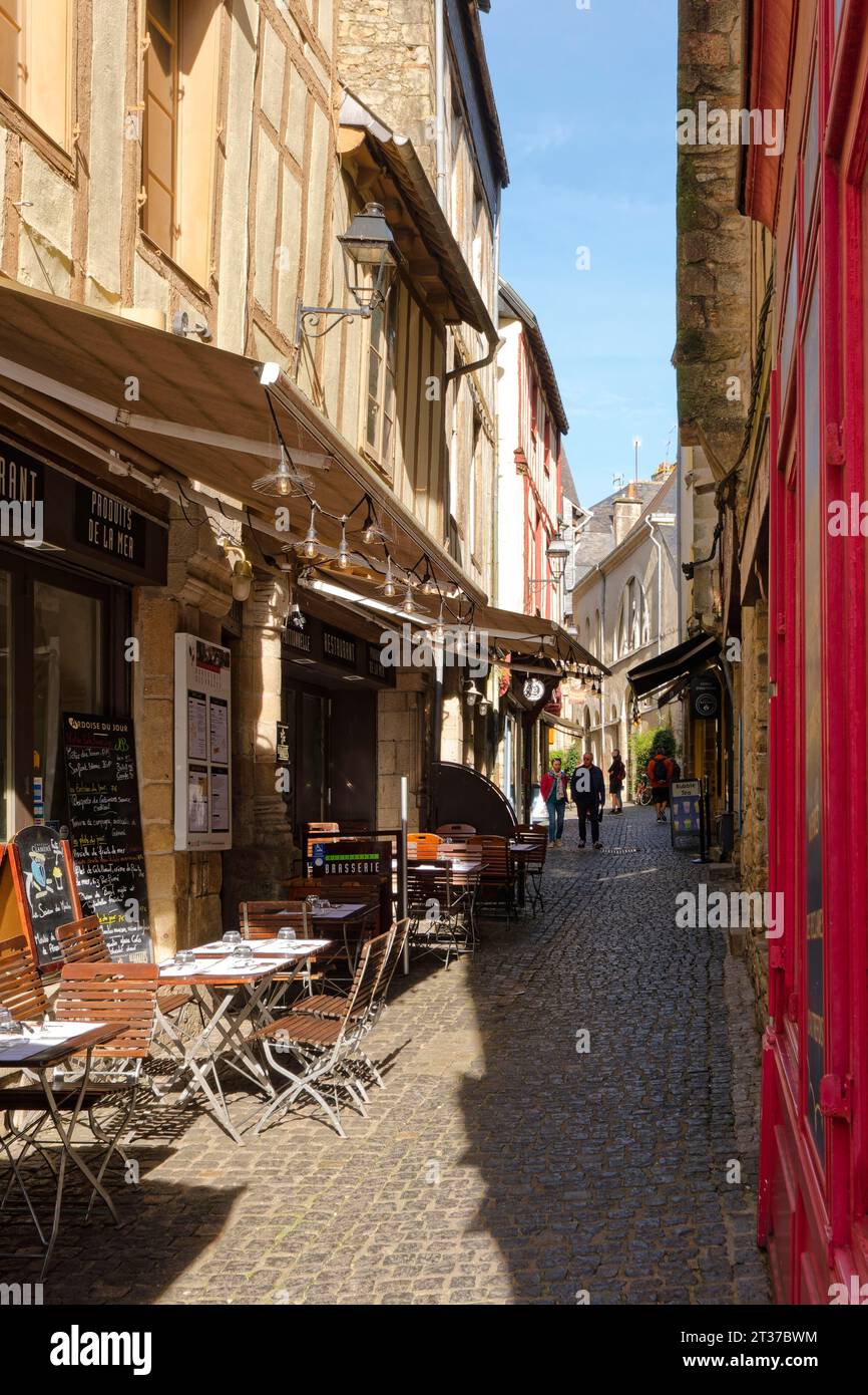 Restaurants and shops in the narrow, cobbled Rue des Halles in the old