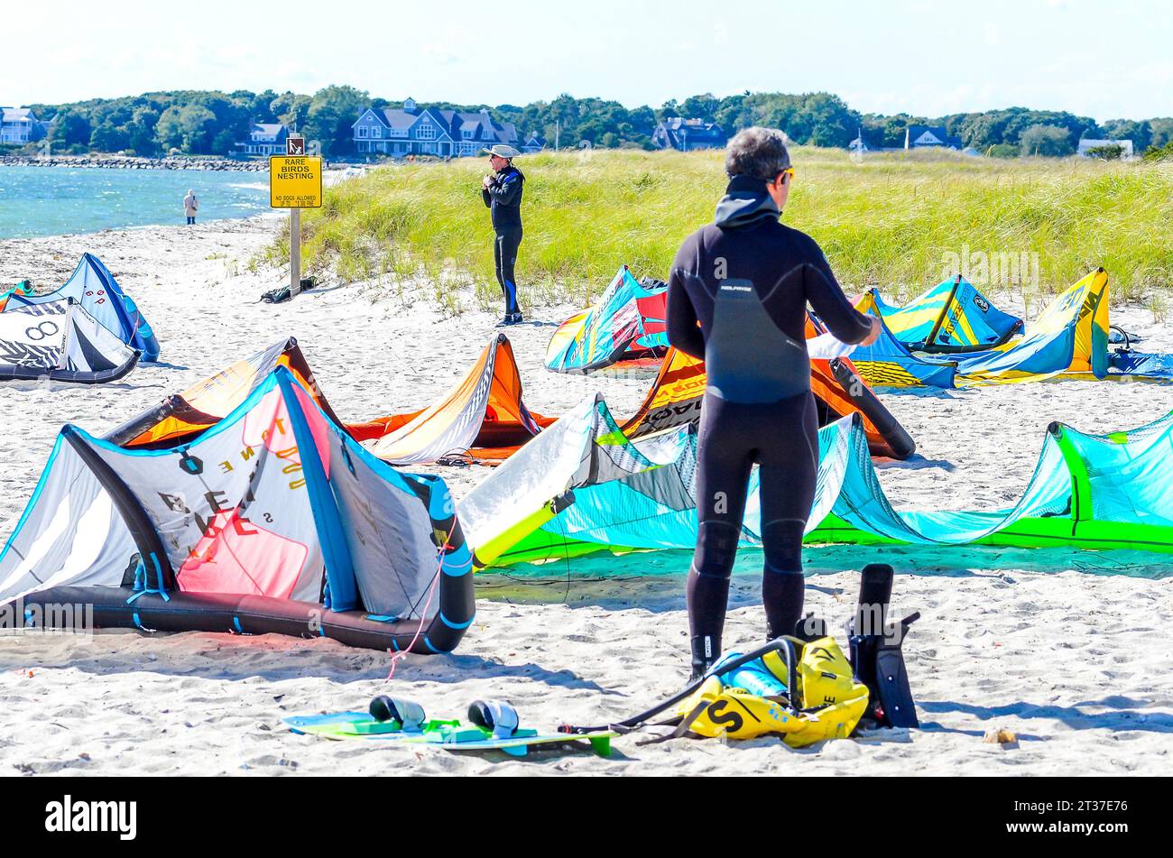 All these Kites must be blown up, so the Windsurfers can have a day in the air as well as fun on the  water. But before the fun, it is work. Stock Photo