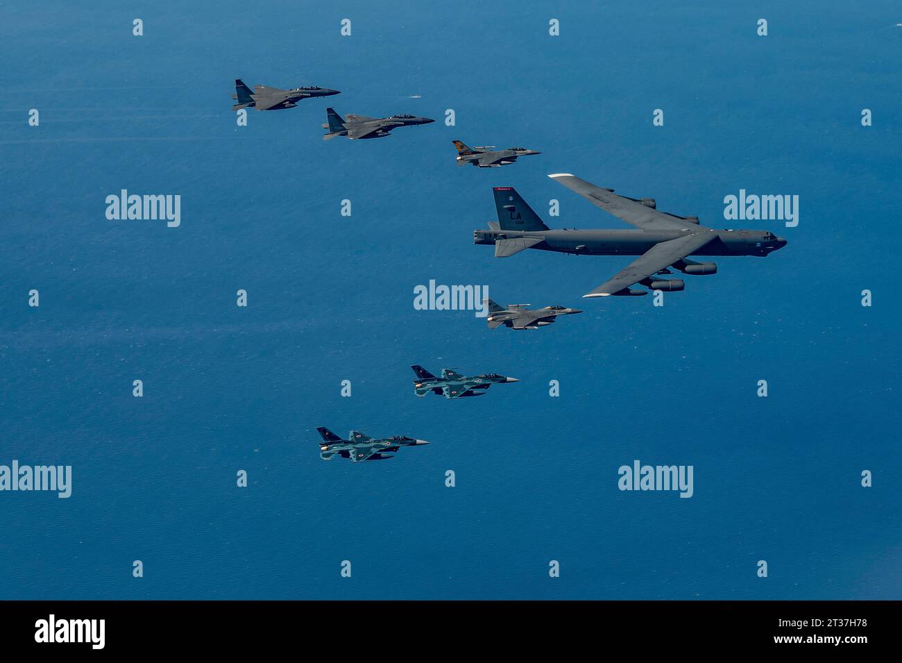 East Sea, South Korea. 19 March, 2023. A U.S. Air Force B-52H Stratofortress heavy bomber is escorted by U.S. F-16 Fighting Falcon fighter aircraft alongside South Korea F-15K fighters and Japanese F-2 fighter aircraft during a trilateral exercise, October 22, 2023 over the Korean Peninsula.  Credit: SrA Karrla Parra/U.S. Air Force Photo/Alamy Live News Stock Photo