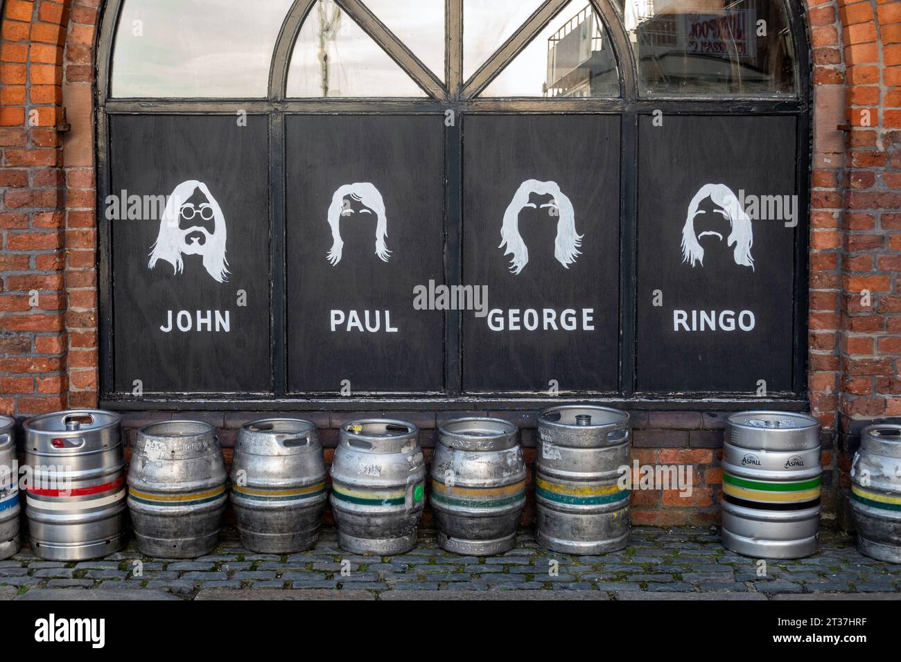 Beatles illustrations and beer barrels outside The Pumphouse, a