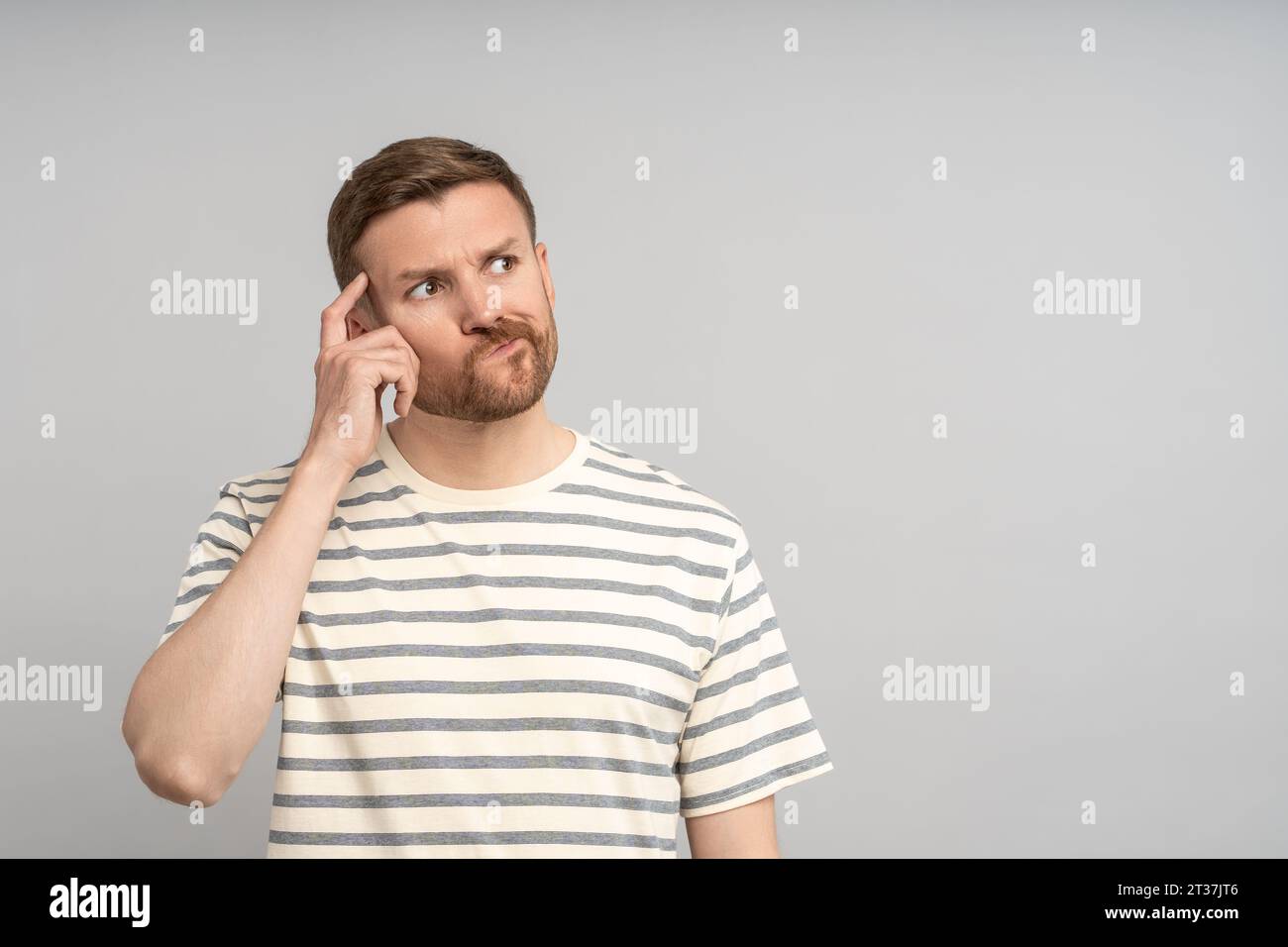 Thoughtful middle-aged man solving problem, planning, thinking of solution, decision, creative idea Stock Photo