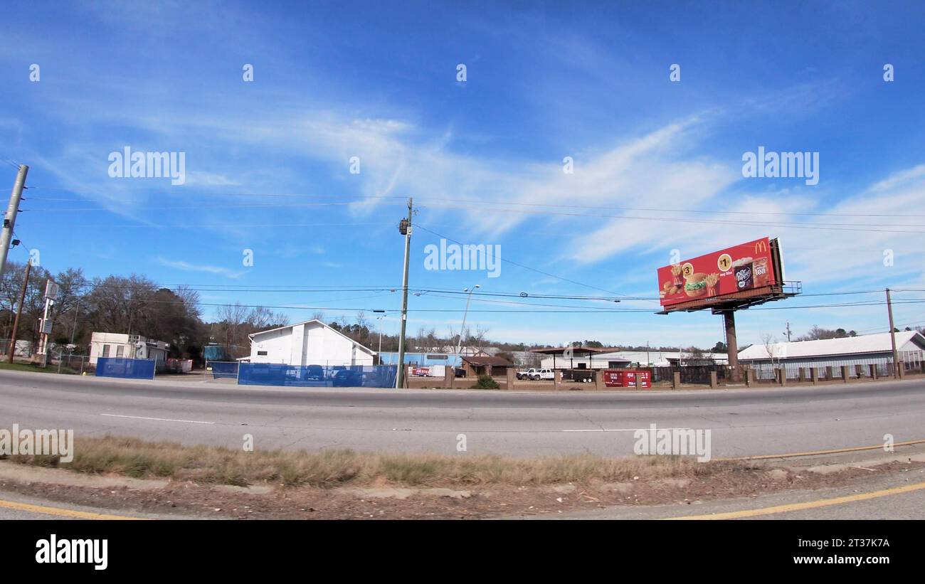 Augusta, Ga USA 01 19 22 POV Driving street pan McDonalds billboard