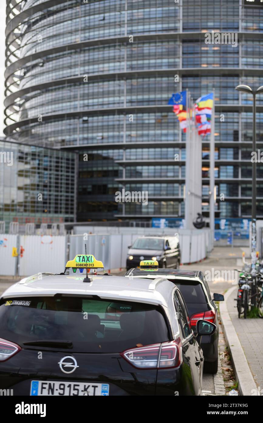 Queue Flag Strasbourg, France - Nov 22, 2023: Taxis waiting in a queue with a ...