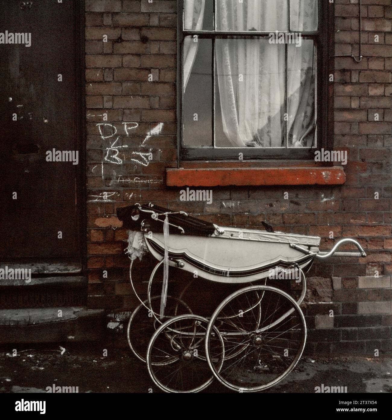 97 Pym Street with a Silver Cross pram parked outside the front door during the slum clearance and demolition of St Ann's, Nottingham. 1969-1972 Stock Photo