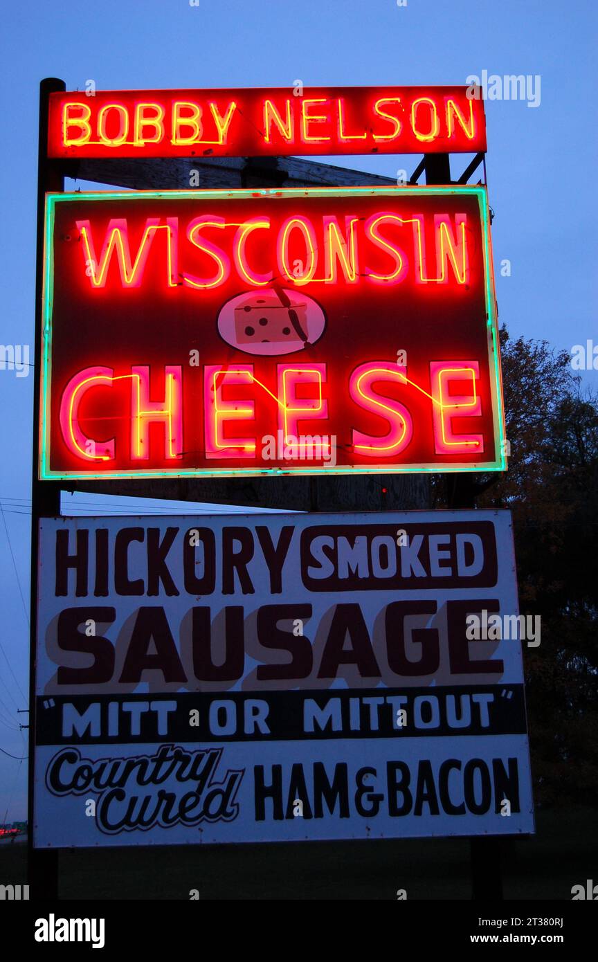 A large neon light sign advertises fresh Wisconsin cheese to travelers and tourists Stock Photo