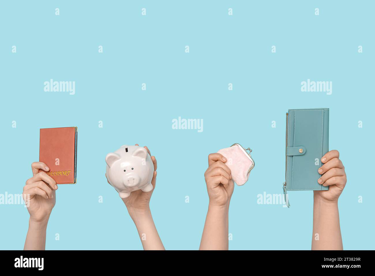 Female hands with passport, piggy bank and wallets on blue background ...