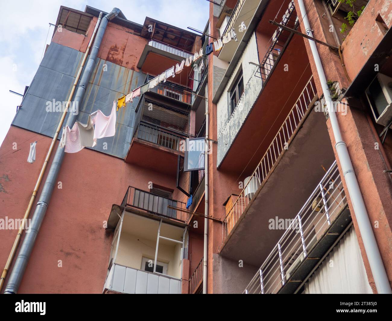 High Rise Daundry Asian high-rise building. The laundry is drying outside on a line. Old ...