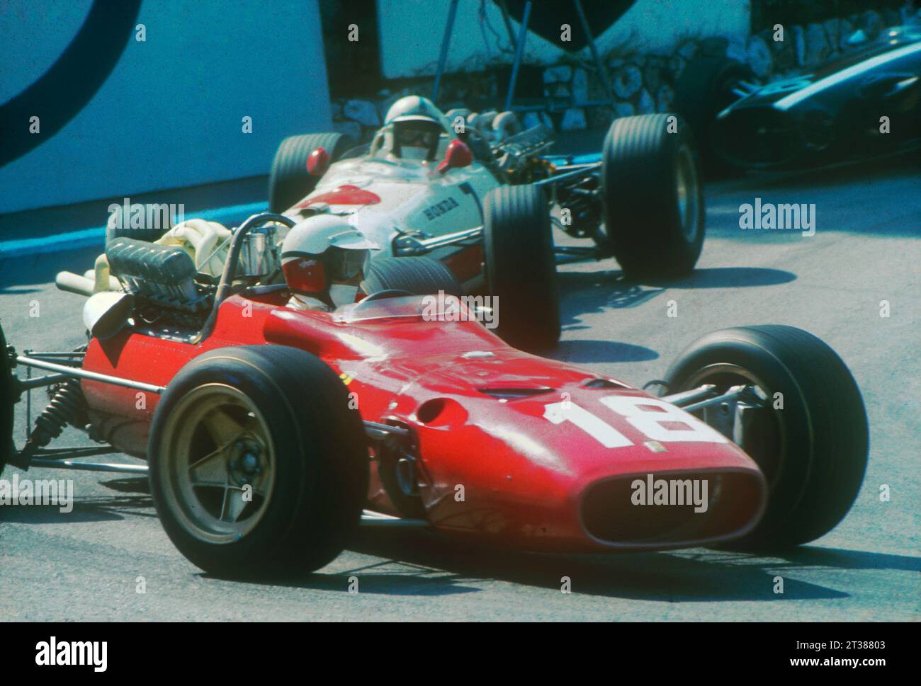 Monaco Granp Prix 1967. Lorenzo Bandini (Ferrari) followed by John Surtees (Honda) at Virage de la Gare (Station Hairpin). Bandini would suffer a tragic accident toward the end of the race. Stock Photo