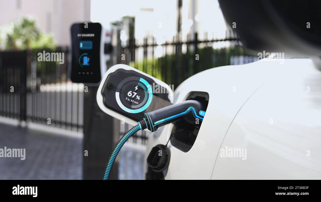 Electric car recharge with EV charger at futuristic car park