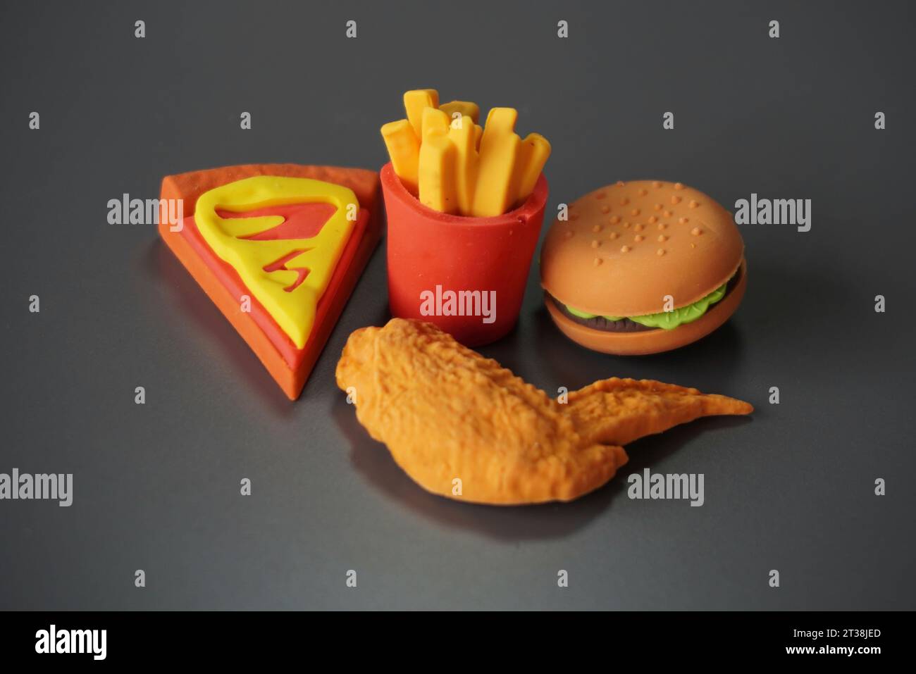 Closeup image of junk foods like burger, fries and pizza. Bad eating habits concept. Stock Photo
