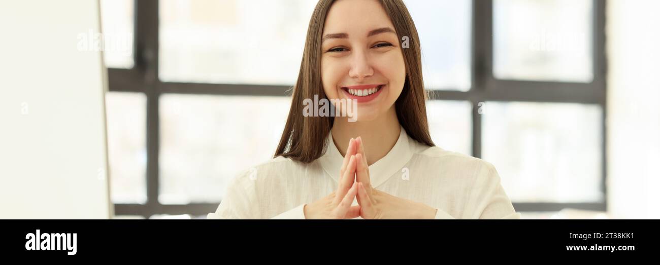 Female employee smiles happily hi-res stock photography and images - Alamy