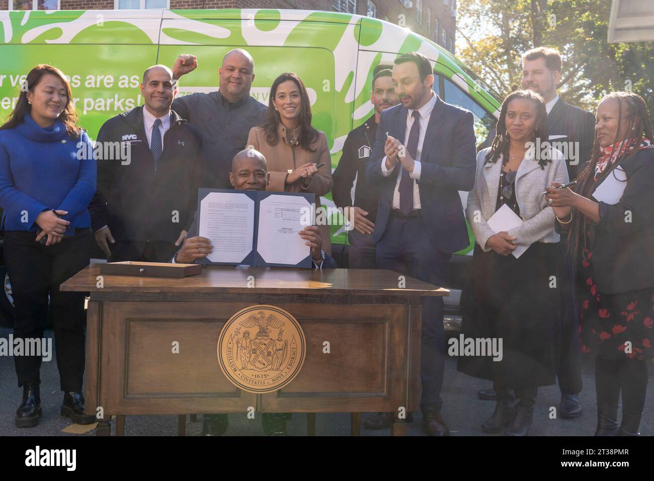 New York, New York, USA. 23rd Oct, 2023. (NEW) Mayor Adams Signs Bill Paving Way For Electrification Of All City Government Vehicles. October 23, 2023, New York, New York, USA: New York City Mayor Eric Adams signs Intro. 279-A at NYCHA's Ravenswood Houses on October 23, 2003 in the Queens borough of New York City. Mayor Adams signs Intro. 279-A, formally codifying the city's goal of transitioning its automobile fleet to all Fully Electric (zero emissions) vehicles (ZEVs) by 2038. In addition, the city will install solar carports at NYCHA parking lots and introducing electri Stock Photo