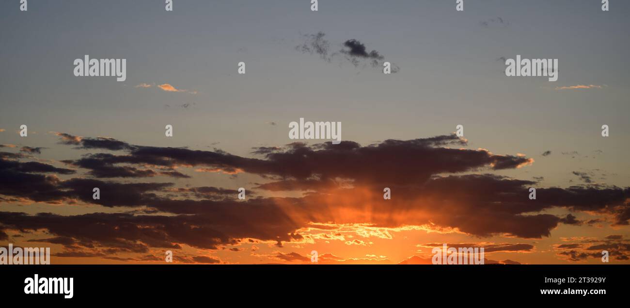Sunset sky with orange clouds. Nature background Stock Photo - Alamy