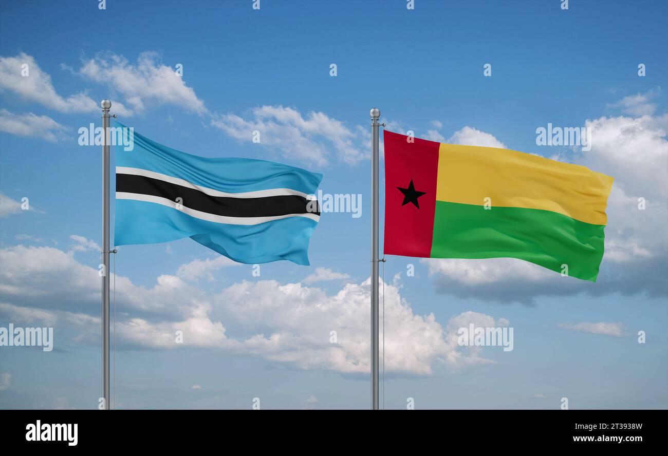 Guinea-Bissau and Botswana flags waving together on blue cloudy sky ...