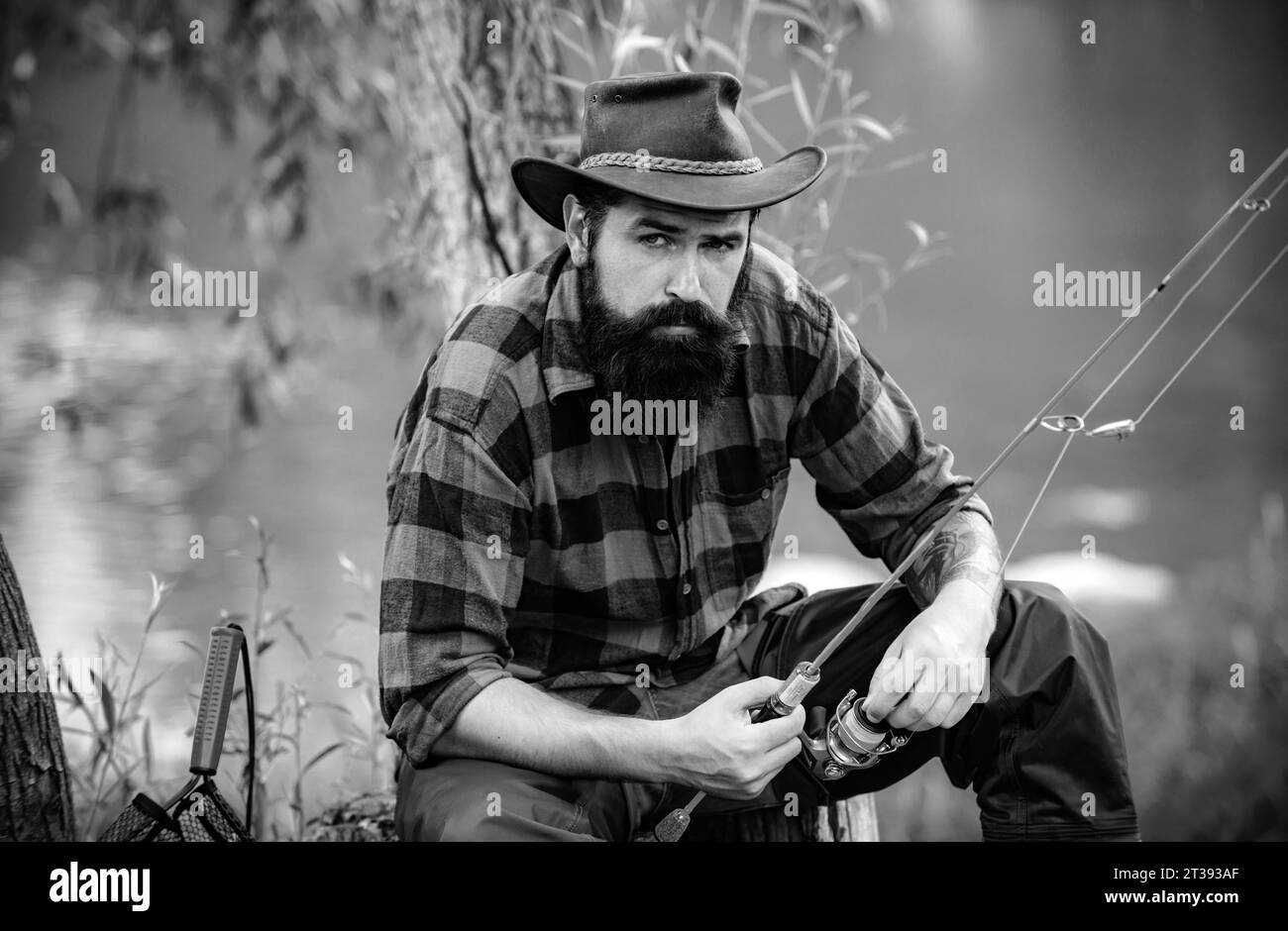Male angler fly fishing Black and White Stock Photos & Images - Alamy