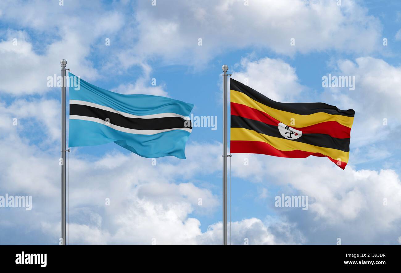Republic of Uganda and Botswana flags waving together in the wind on ...