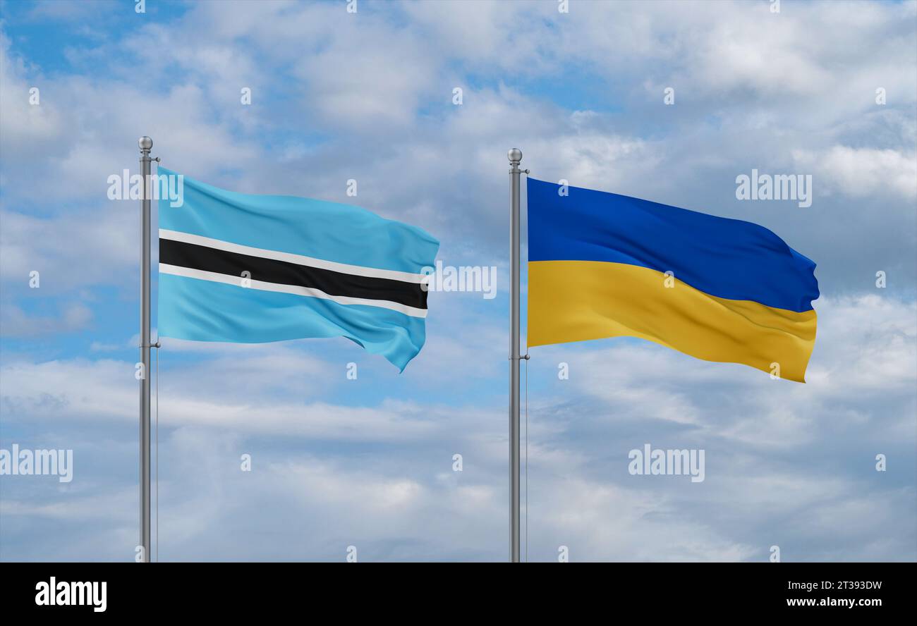 Ukraine and Botswana flags waving together in the wind on blue cloudy ...