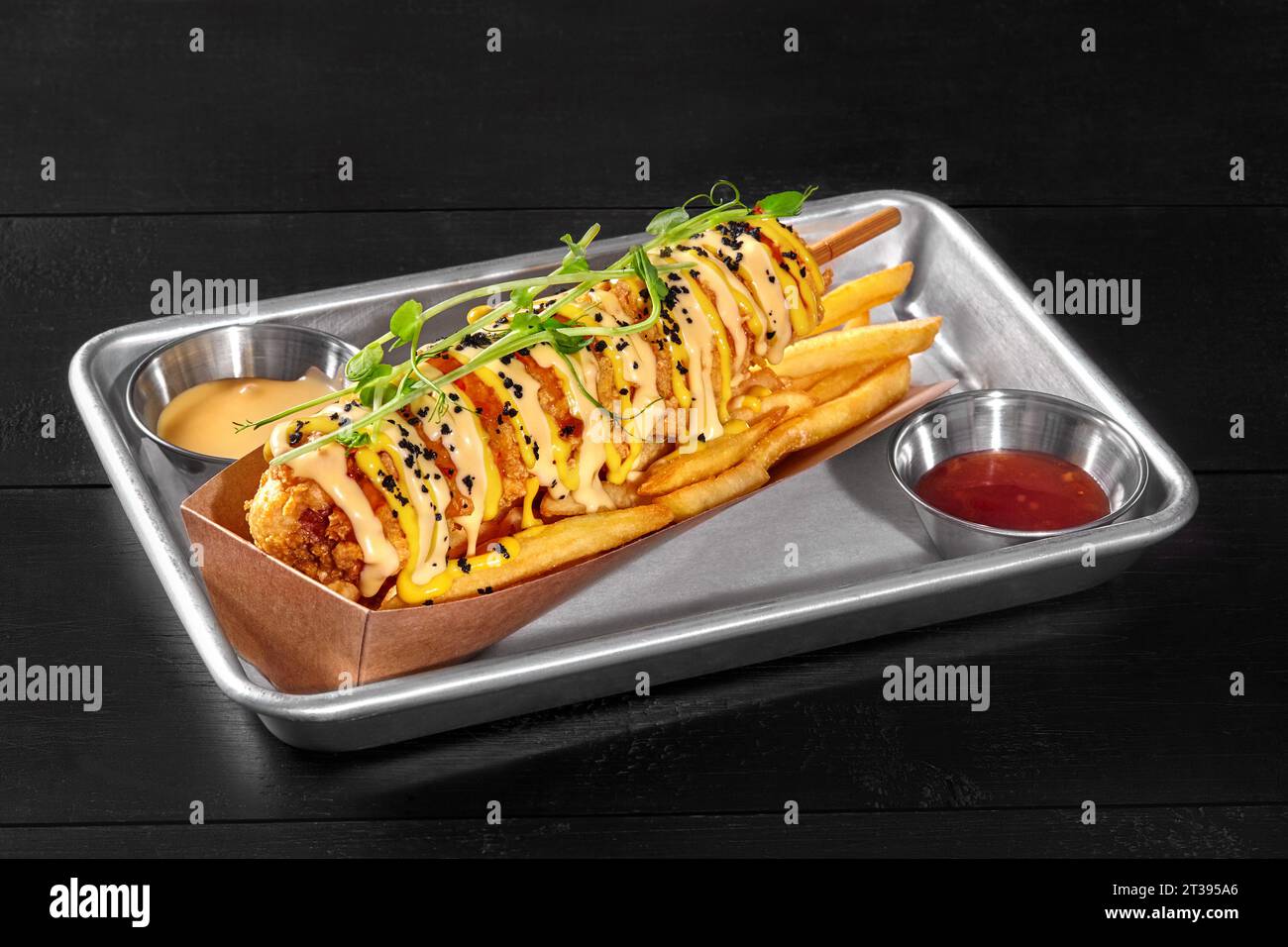 Corn dog in cornmeal batter with potato fries, sweet chili and cheddar