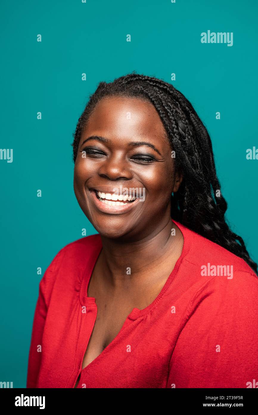 Woman smiling warmly closed hi-res stock photography and images - Alamy