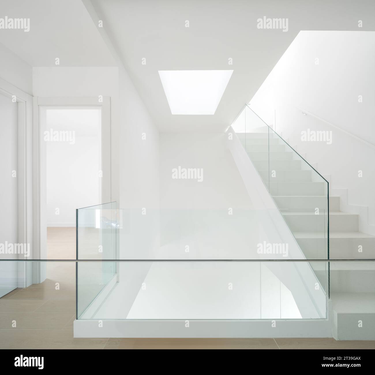 Bright interior hallway with modern design, featuring a staircase ...